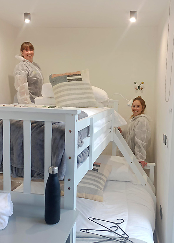 Volunteers painting holiday accommodation