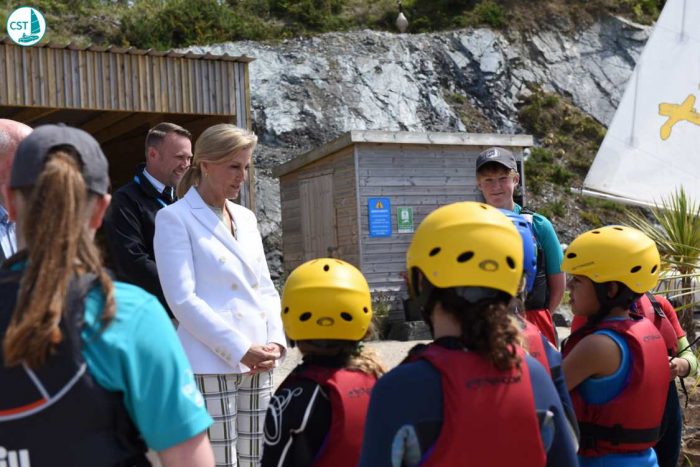 HRH meets local children from Garras school on the beach at Trevassack Lake, Children's Sailing Trust